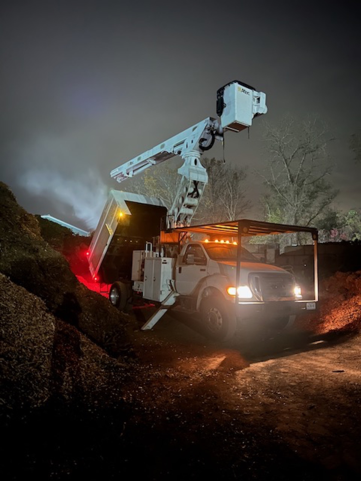 Emergency tree service at night with bucket truck Peekskill NY