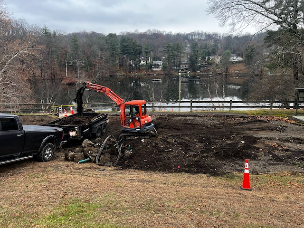 Excavator removing stumps during land clearing in Cortlandt Manor NY